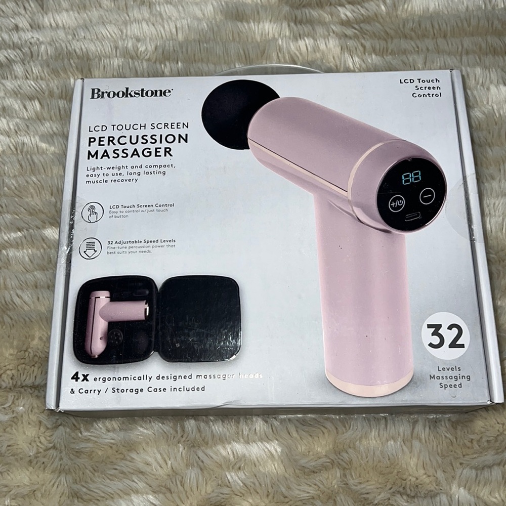 LCD pink touchscreen percussion massager by BROOKSTONE